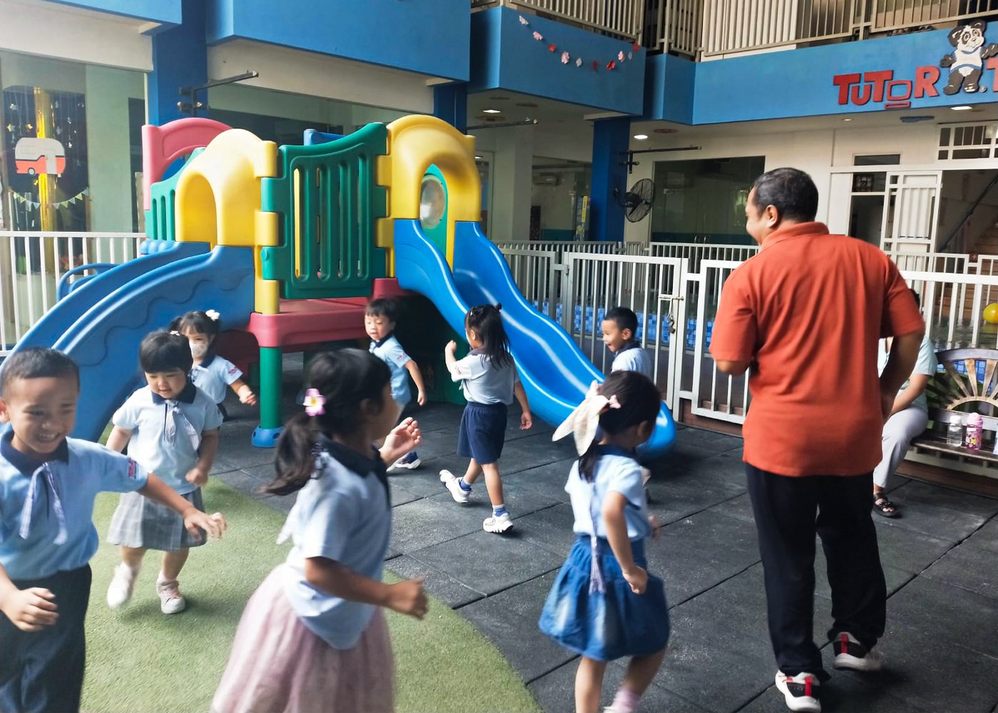 Children enjoying active outdoor play at Tutor Time Intercon